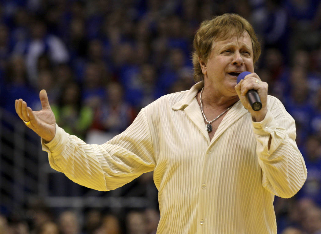 FILE - In this Jan. 25, 2010 file photo, Eddie Money sings the national anthem before an NCAA c ...