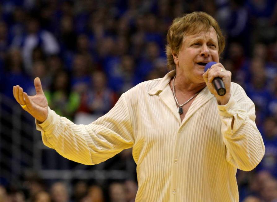 FILE - In this Jan. 25, 2010 file photo, Eddie Money sings the national anthem before an NCAA c ...