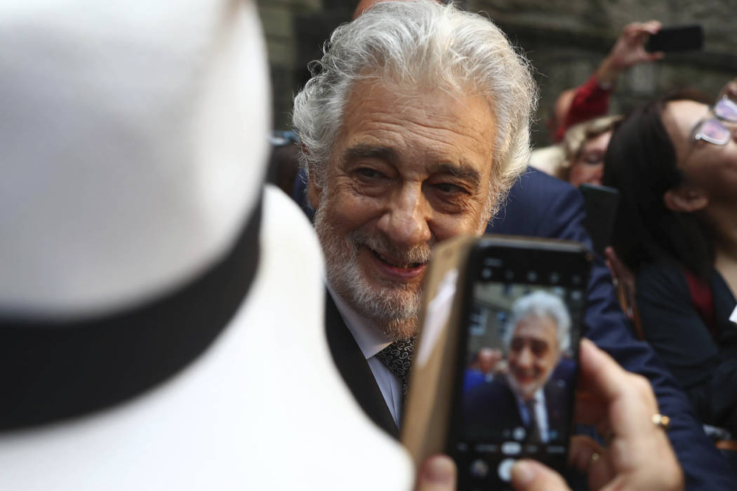 Placido Domingo talks to fans at the 'Festspielhaus' opera house after he performed 'Luisa Mill ...