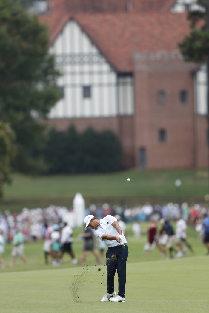 Xander Schauffele hits from the fourth fairway during the final round of the Tour Championship ...