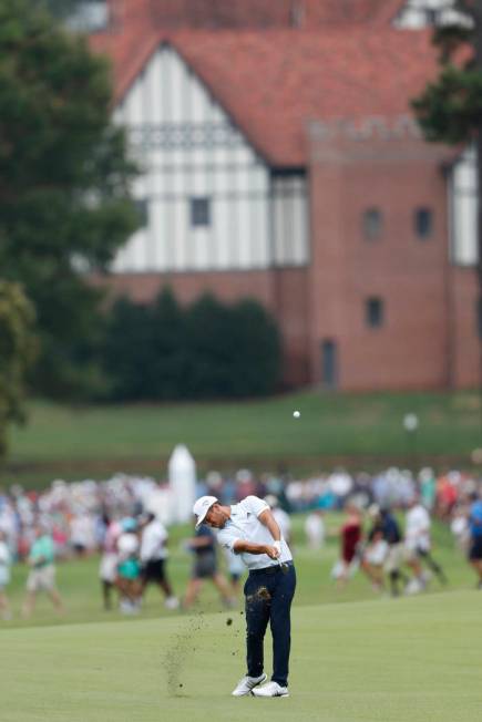 Xander Schauffele hits from the fourth fairway during the final round of the Tour Championship ...