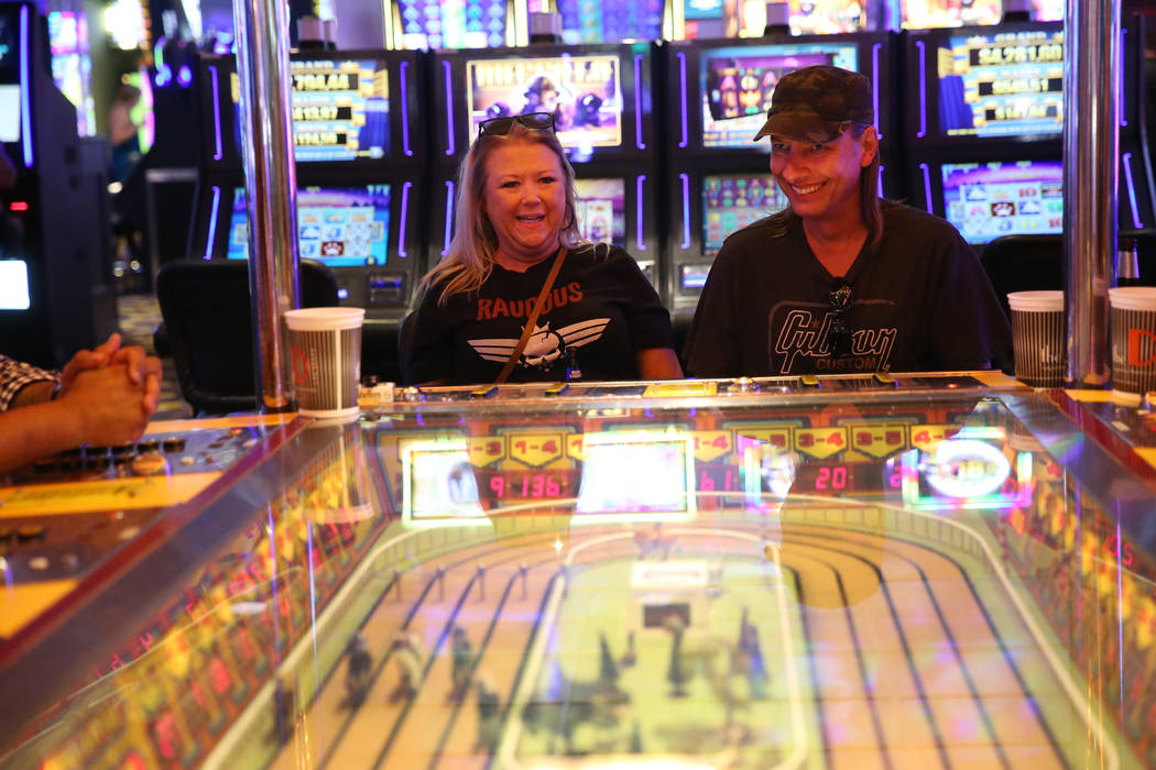 Tammy Beggs, left, and her boyfriend Steve Stefanoff, of Tulsa, Okla., play the Sigma Derby mac ...