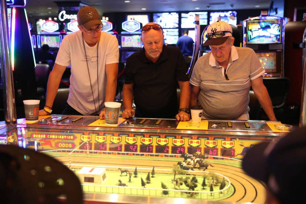 Brock Watson, from left, his father Eldon, and grandfather Phillip Julian, from Pennsylvania, p ...