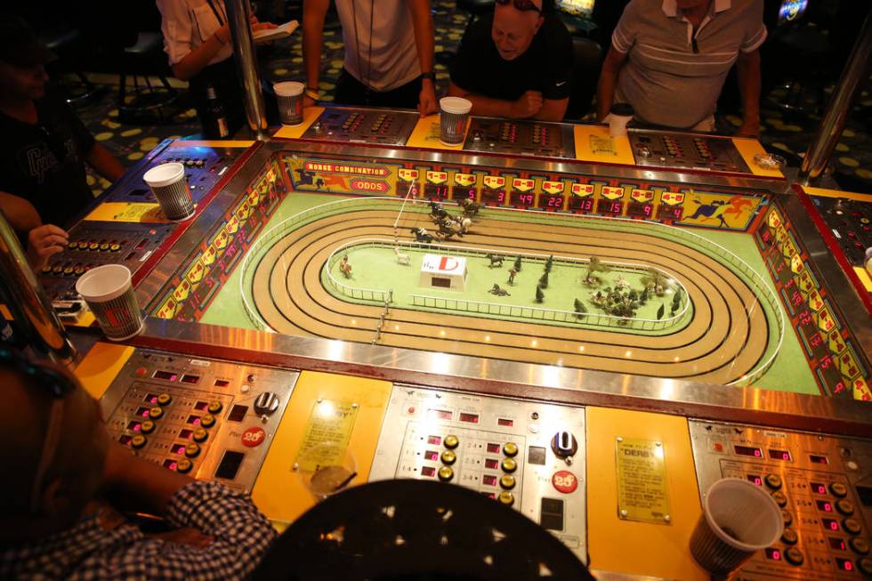 People play the Sigma Derby machine at the D Las Vegas hotel-casino in Las Vegas, Friday, Aug. ...