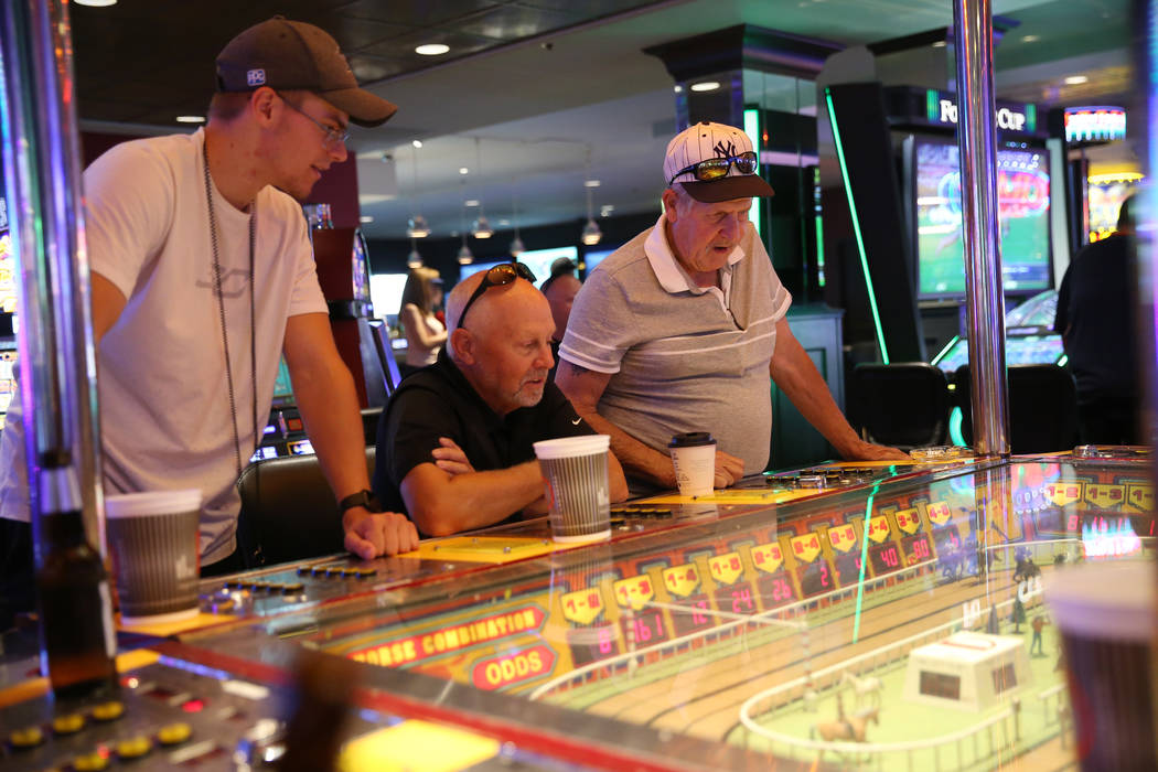 Brock Watson, from left, his father Eldon, and grandfather Phillip Julian, from Pennsylvania, p ...