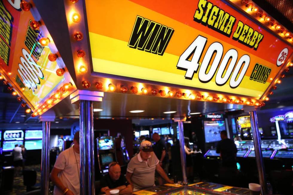 People play the Sigma Derby machine at the D Las Vegas hotel-casino in Las Vegas, Friday, Aug. ...