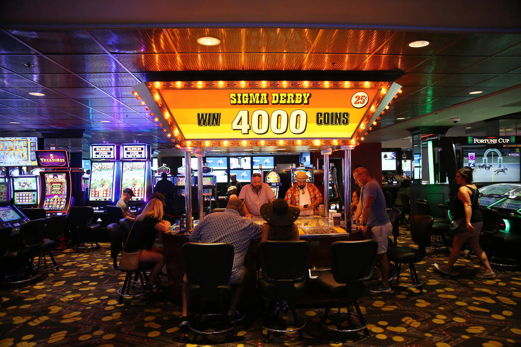 People play the Sigma Derby machine at the D Las Vegas hotel-casino in Las Vegas, Friday, Aug. ...