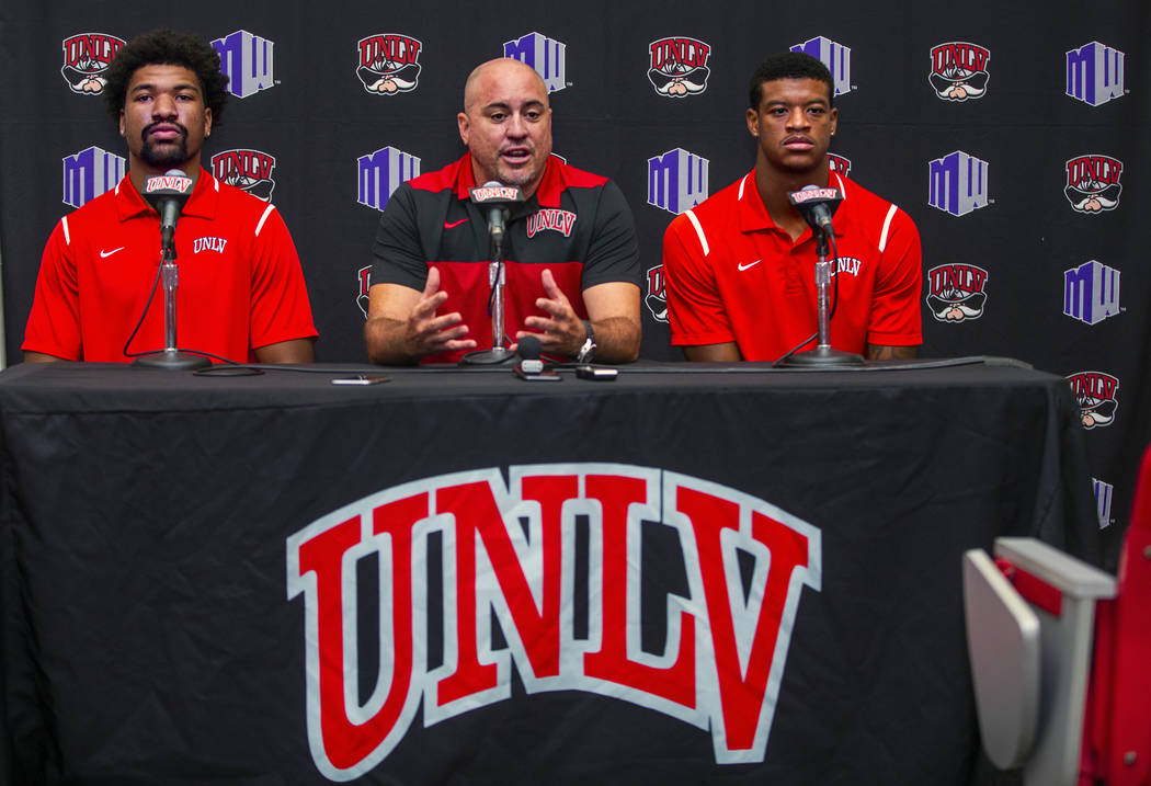 UNLV football quarterback Armani Rogers, head coach Tony Sanchez and linebacker Javin White par ...