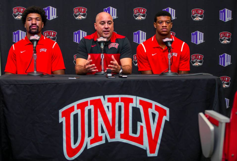 UNLV football quarterback Armani Rogers, head coach Tony Sanchez and linebacker Javin White par ...