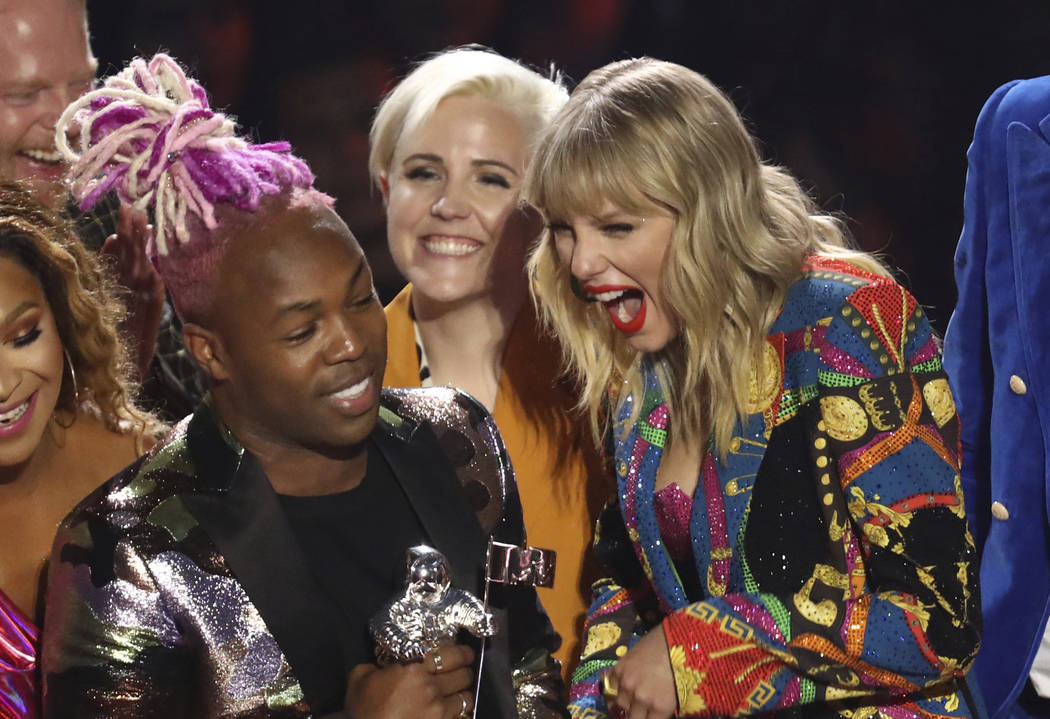 Taylor Swift, right, accepts the video for good award for "You Need to Calm Down" at ...