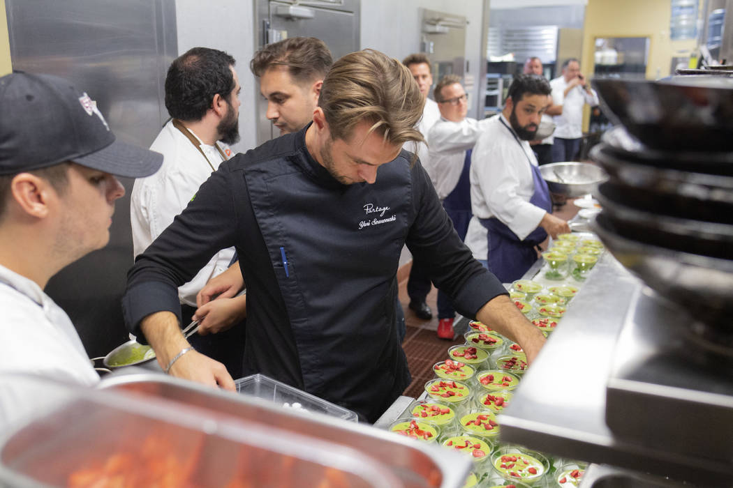 Chef Yuri Szarzewski of EATT Groumet Bistro prepares the chilled sweet pea, spinach and mint so ...