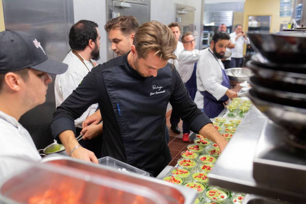 Chef Yuri Szarzewski of EATT Groumet Bistro prepares the chilled sweet pea, spinach and mint so ...