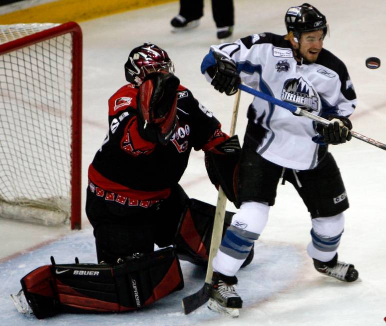 Idaho Steelhead hockey player Lance Galbraith tries to deflect the puck into the net as Vegas W ...