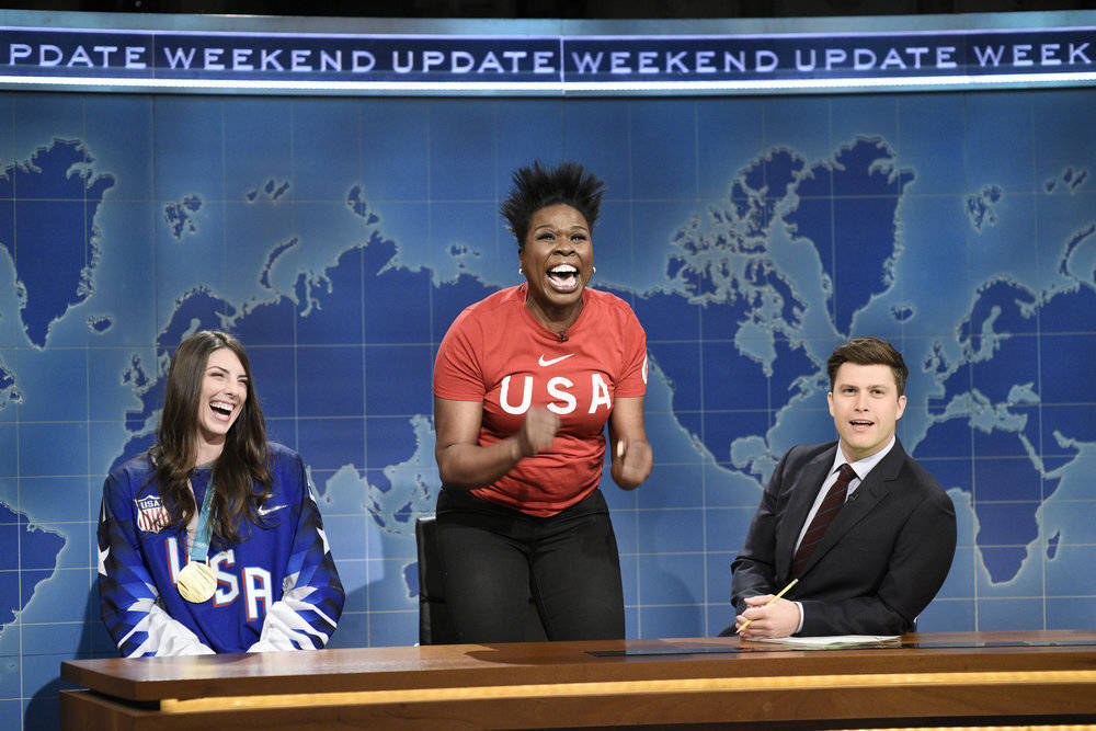 This March 3, 2018 photo released by NBC shows Leslie Jones, center, flanked by Ice Hockey Olym ...