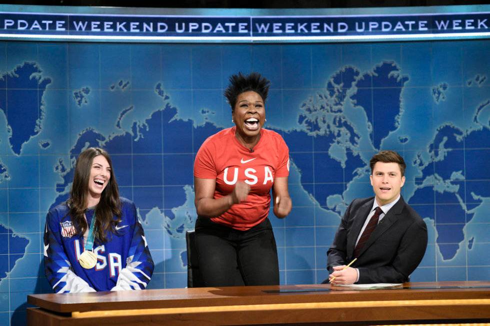 This March 3, 2018 photo released by NBC shows Leslie Jones, center, flanked by Ice Hockey Olym ...