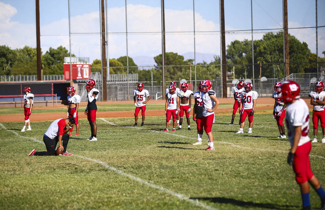 Players during football practice at the baseball field at Valley High School in Las Vegas on We ...