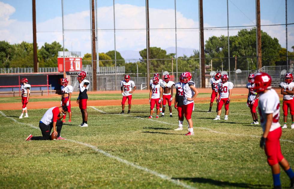 Players during football practice at the baseball field at Valley High School in Las Vegas on We ...