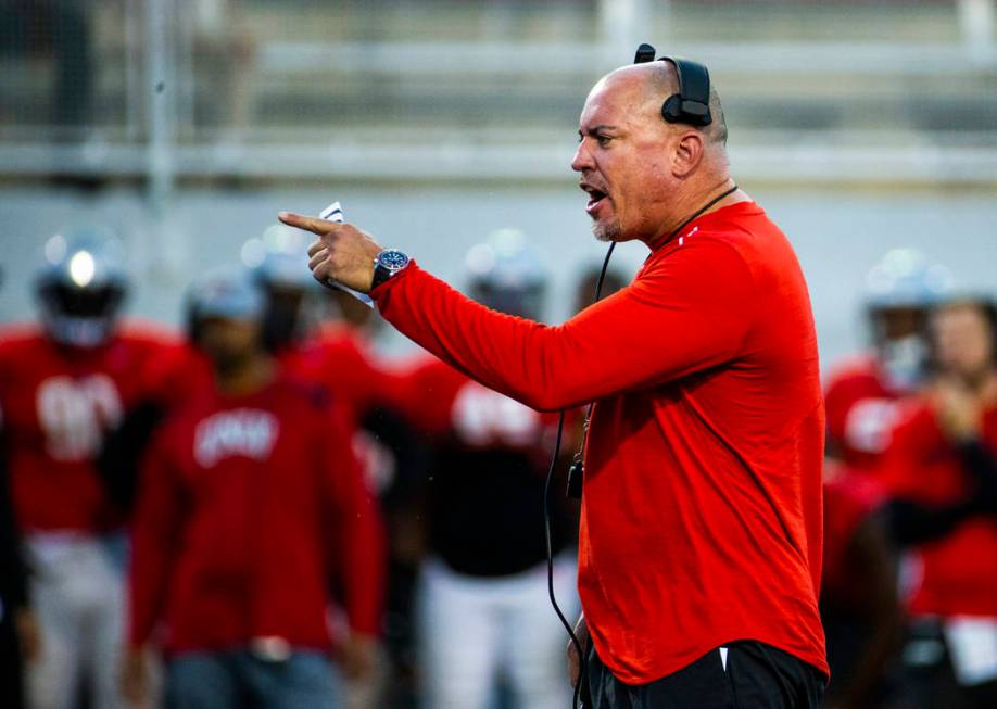 UNLV head coach Tony Sanchez yells a few instructions to his players during their first major s ...