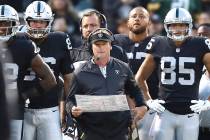 Oakland Raiders coach Jon Gruden, center, watches during the first half of the team's NFL prese ...