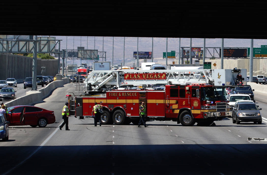 Las Vegas firefighters at the scene of multi-vehicle crash at US Highway 95 southbound near Dec ...
