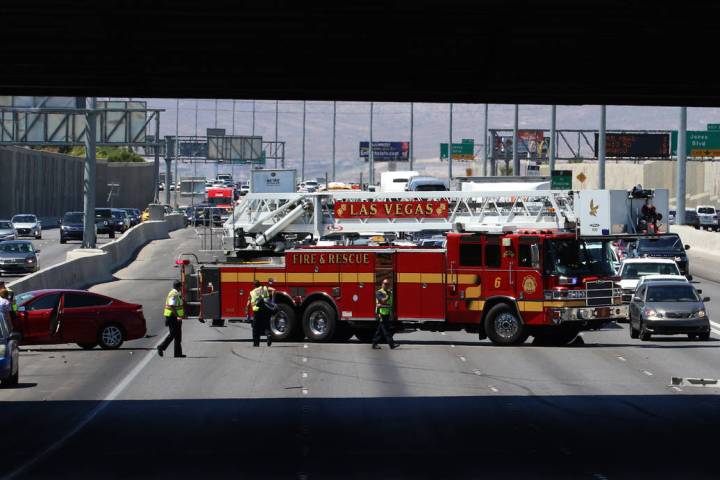 Las Vegas firefighters at the scene of multi-vehicle crash at US Highway 95 southbound near Dec ...