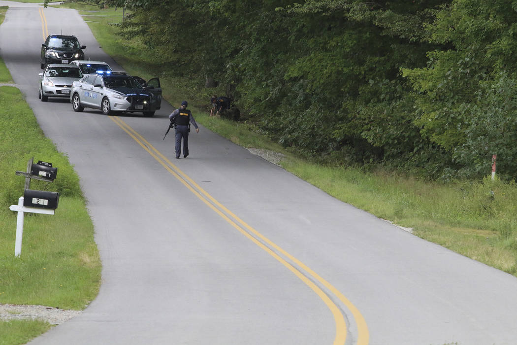 Police apprehend Matthew Thomas Bernard on Tuesday, Aug. 27, 2019 in Keeling, Va. The wife, tod ...