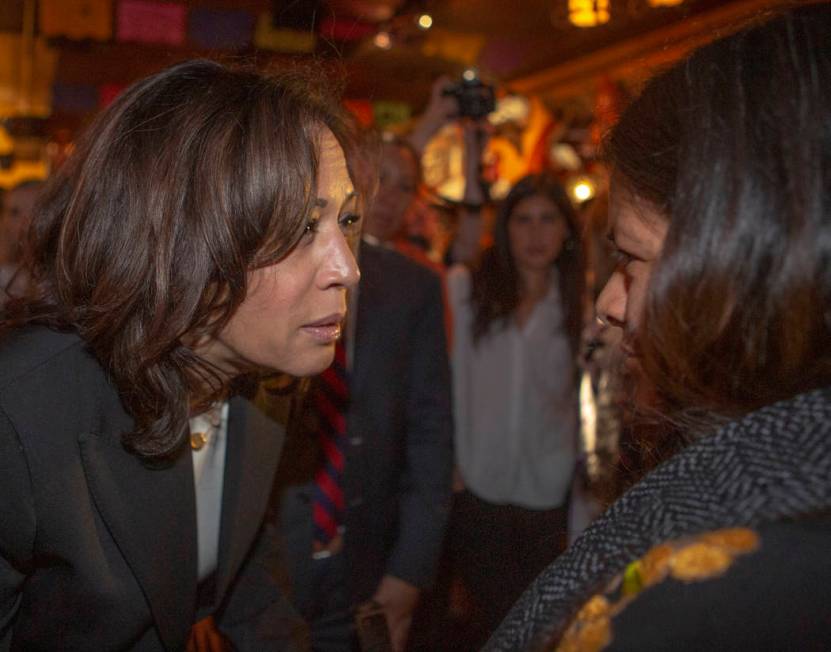 Democratic presidential candidate Sen. Kamala Harris, D-Calif., consoles Minerva Martinez, 47, ...