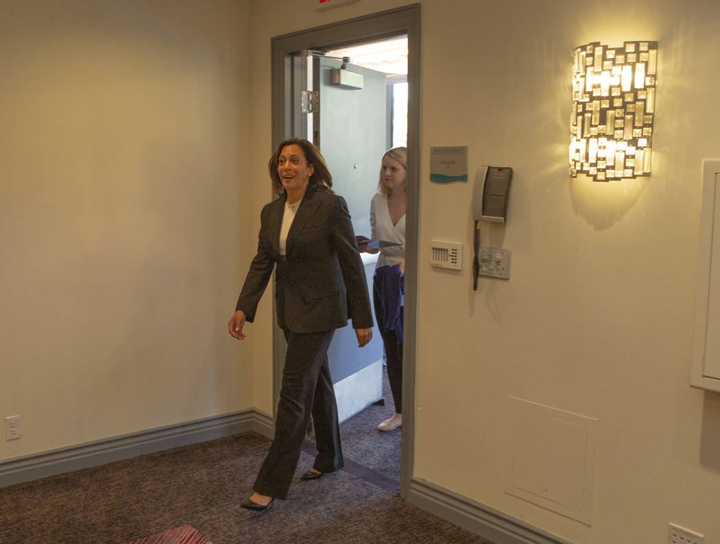 Democratic presidential candidate Sen. Kamala Harris, D-Calif., walks into the press room for i ...