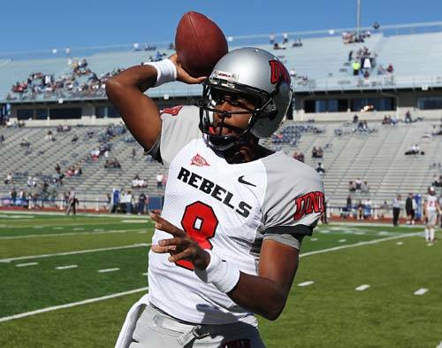 UNLV starting quarterback Caleb Herring warms up before taking on UNR at Mackay Stadium in Reno ...