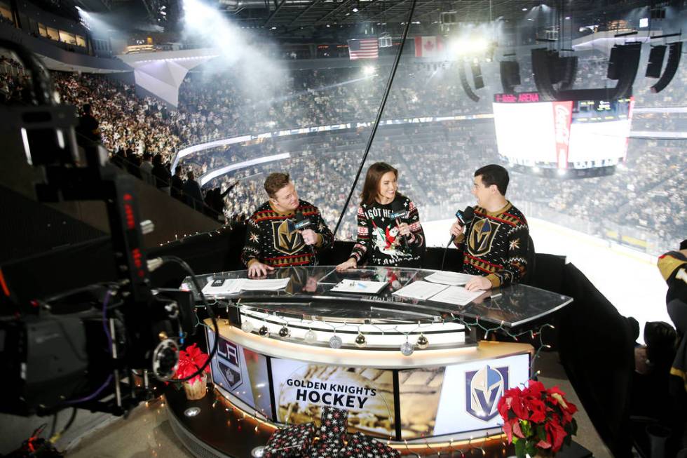 Alyson Lozoff, the rinkside reporter for the Vegas Golden Knights, center, speaks to fellow hos ...