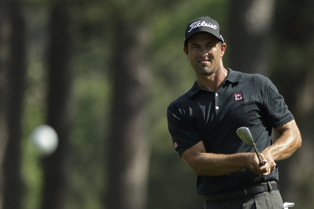 Adam Scott, of Australia, watches his shot on the eighth hole during the third round for the Ma ...