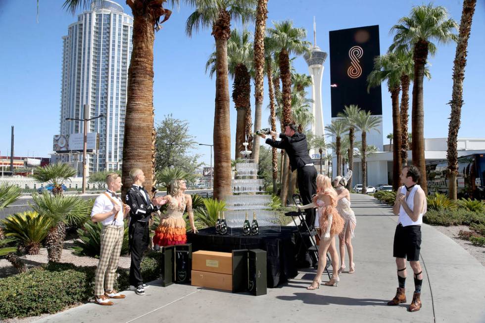 Cast members for Blanc de Blanc participate during the Sahara Las Vegas rebranding event outsid ...