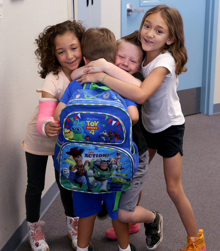 Students, from left, Willow Dennis, 5, Luca Pacella, 5, Daniel Carter, 5, and Elli Carter, 6, h ...
