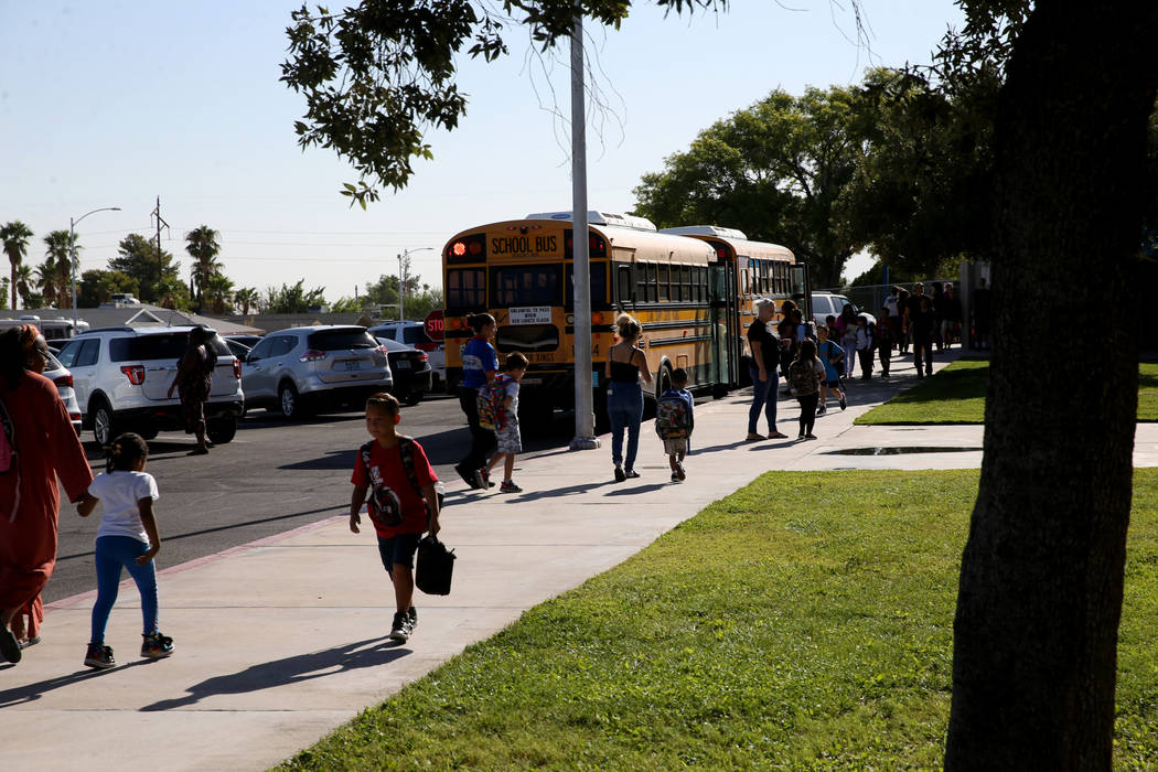 Students arrive at Helen Smith Elementary School in Las Vegas Thursday, Aug. 29, 2019, one day ...