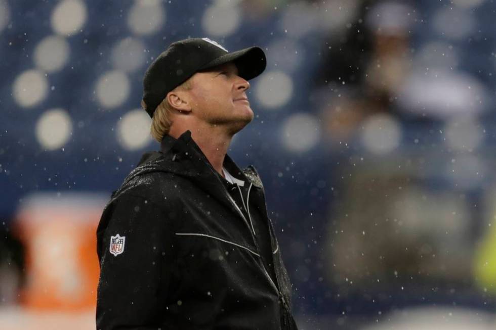 Oakland Raiders head coach Jon Gruden stands on the field before an NFL football preseason game ...