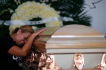 Vanessa Galindo Blas grieves on the coffin that contains the remains of her late husband Erick ...