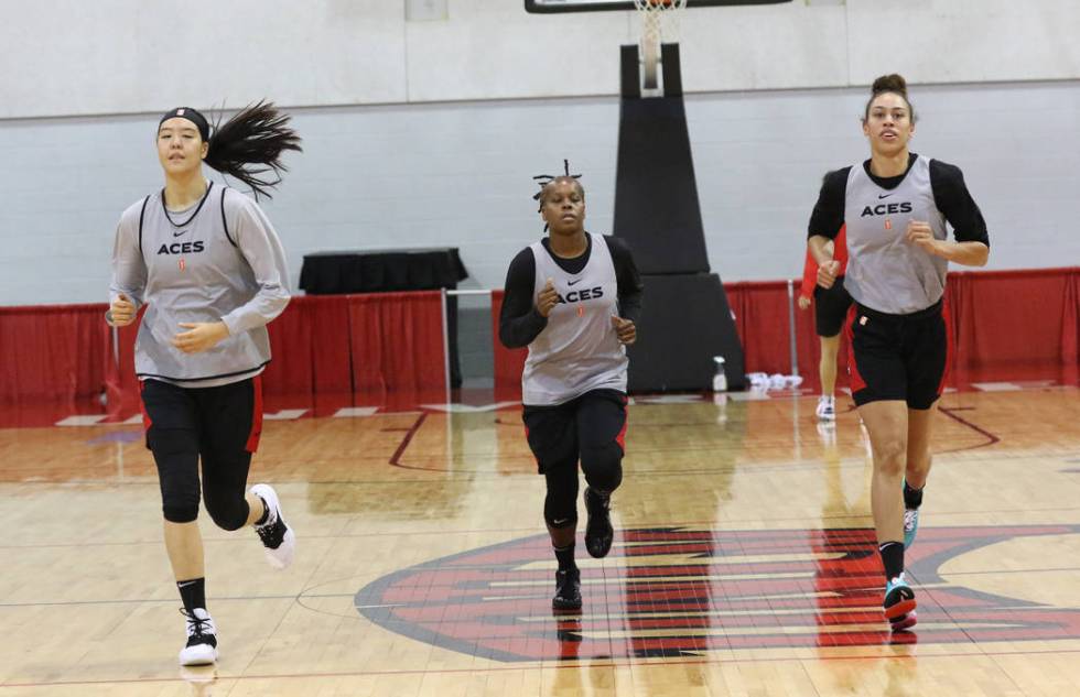 Las Vegas Aces' players Ji-Su Park, left, guard Epiphanny Prince, center, and Dearica Hamby war ...