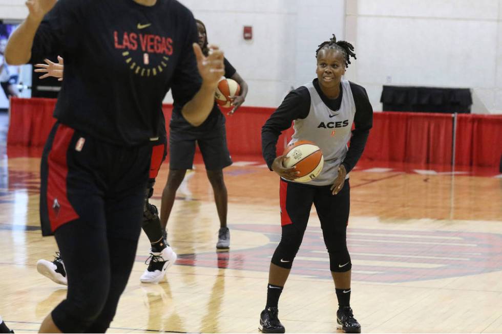 Las Vegas Aces' guard Epiphanny Prince, right, prepares to shoot the ball during team practice ...