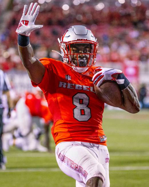 UNLV Rebels running back Charles Williams (8) celebrates a touchdown over Southern Utah at Sam ...