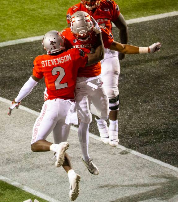 UNLV Rebels wide receiver Mekhi Stevenson (2) and teammate wide receiver Jacob Gasser (82) cele ...