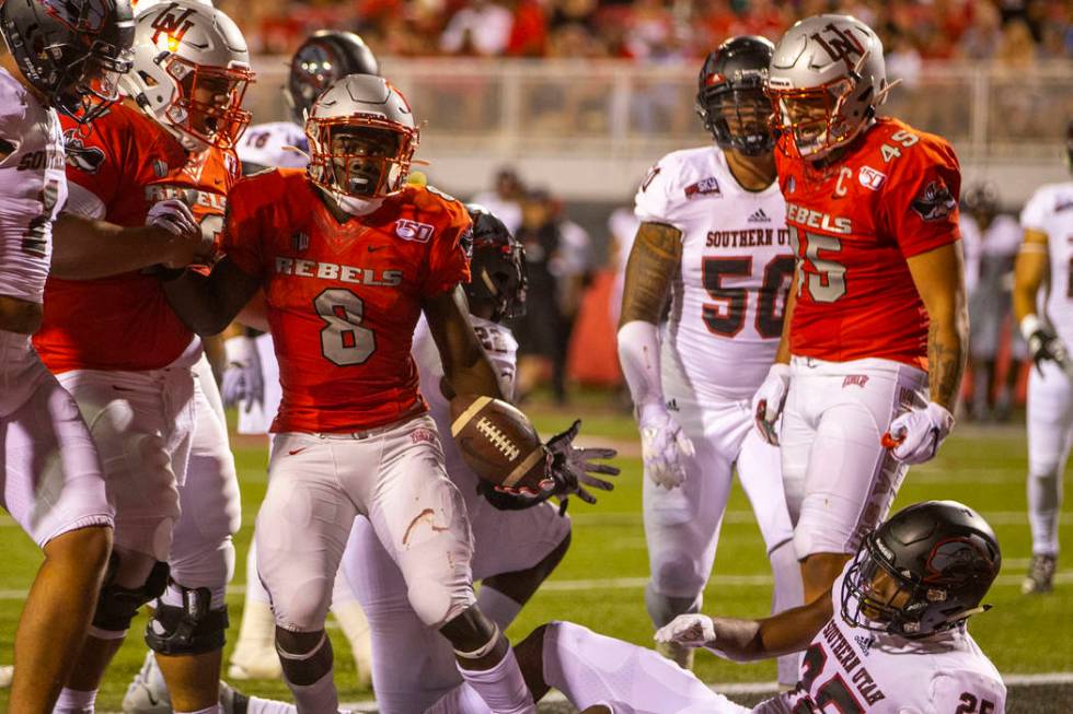 UNLV Rebels running back Charles Williams (8) celebrates a touchdown over Southern Utah at Sam ...