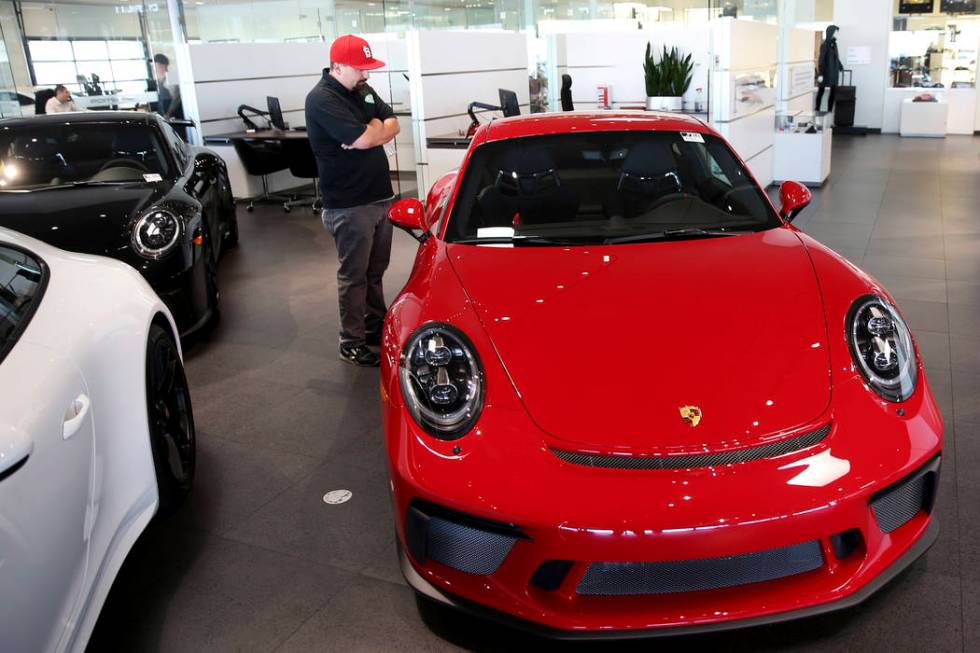 John Stephens of Las Vegas checks out a 2018 911 GT3 at Gaudin Porsche in Las Vegas Friday, Aug ...