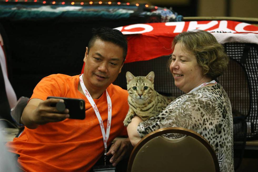 Marlon Azada, left, of Houston, and his friend Irene Van Belzen of the Netherlands, take a phot ...