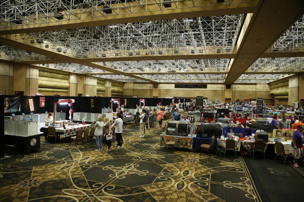 People attend The International Cat Association's (TICA) 40th annual show at the Rio Convention ...