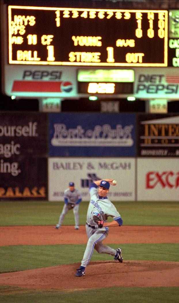 Toronto Blue Jays starting pitcher Erik Hanson pitches to an Oakland Athletics batter in the fi ...