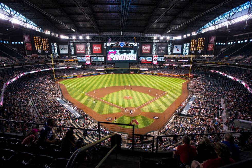 Fans watch the action during an Arizona Diamondbacks baseball game against the Philadelphia Phi ...