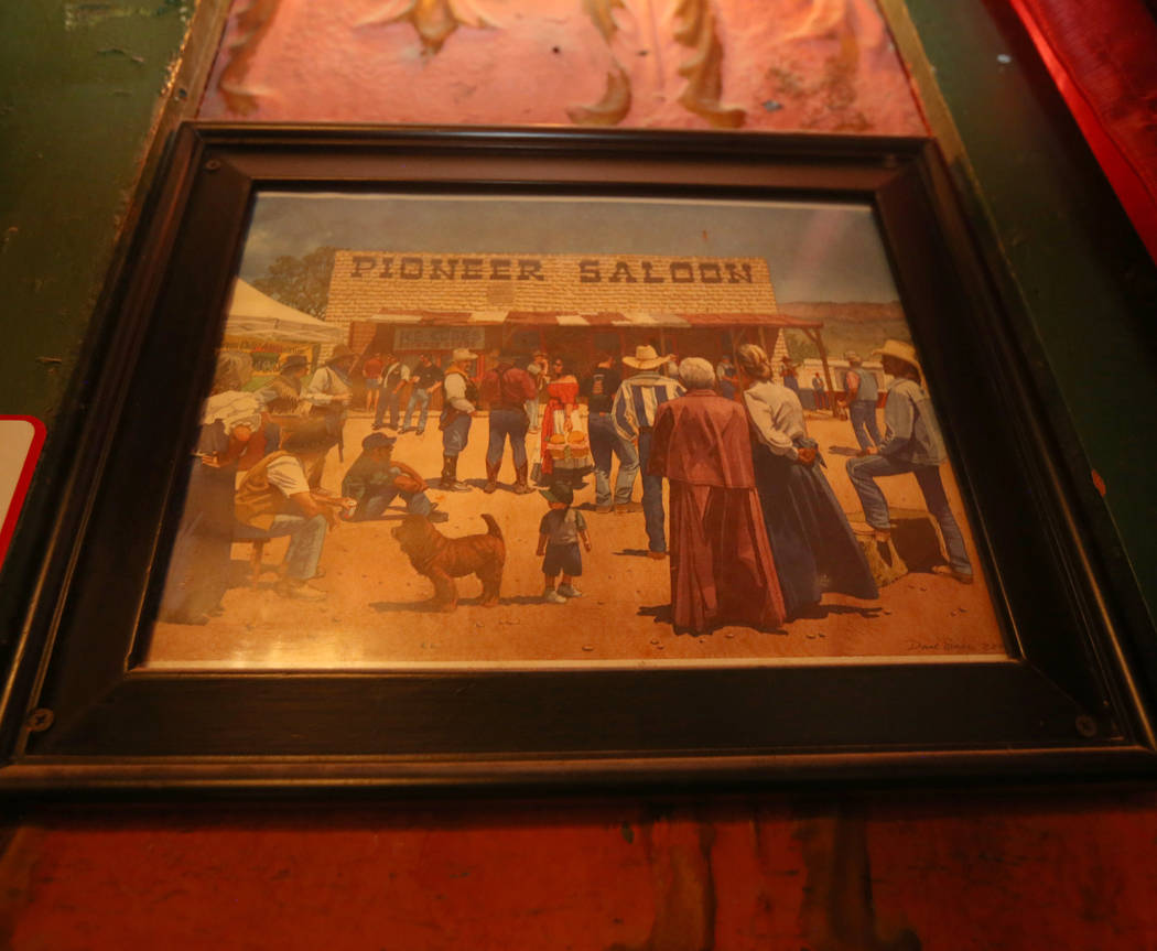 A framed painting hangs in the dining room of the Pioneer Saloon in Goodsprings, July 31, 2019. ...