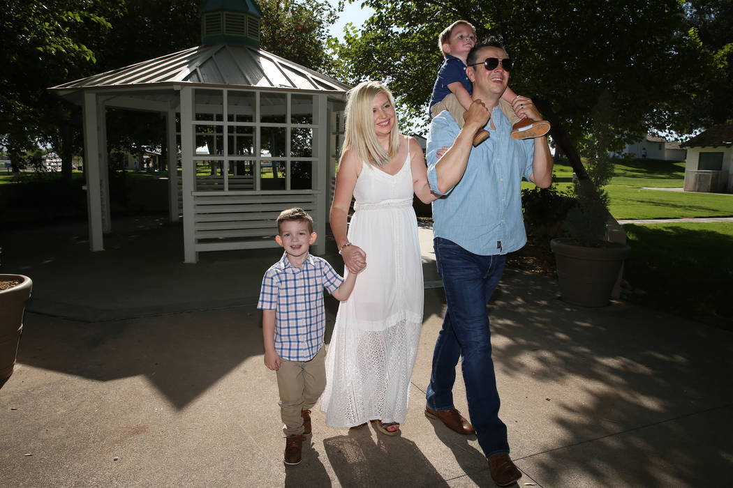 Charlie Bayley, second from left, with her son Logan, left, and husband Steve, with her son Noa ...