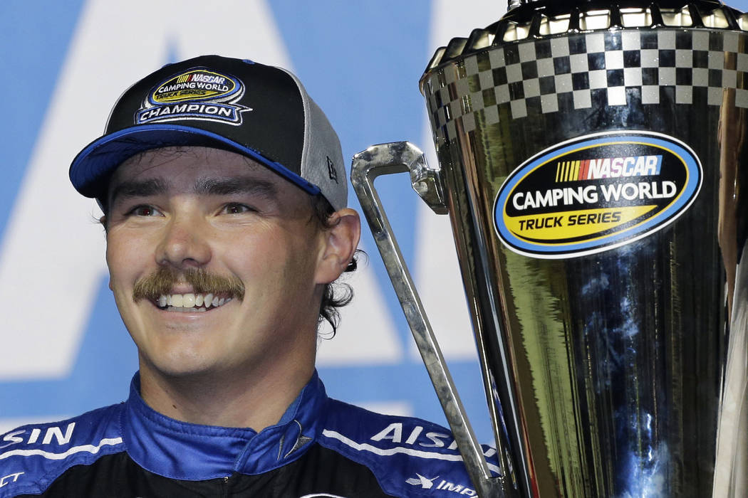 In this Nov. 16, 2018, file photo, Brett Moffitt stands with his trophy in Victory Lane after w ...