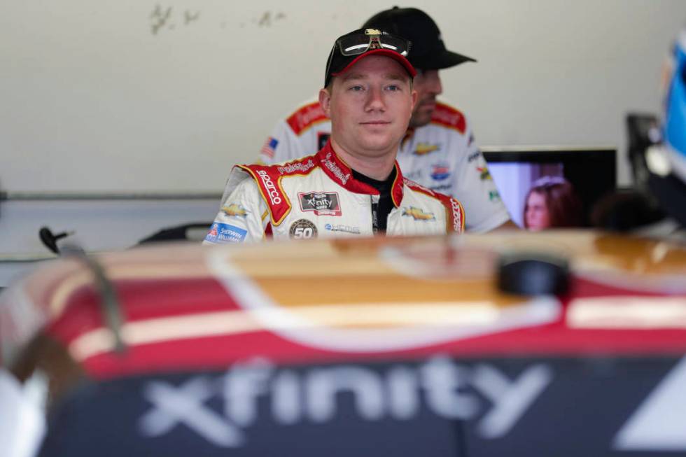 NASCAR Xfinity Series driver Tyler Reddick waits in the garage area before the start of NASCAR ...